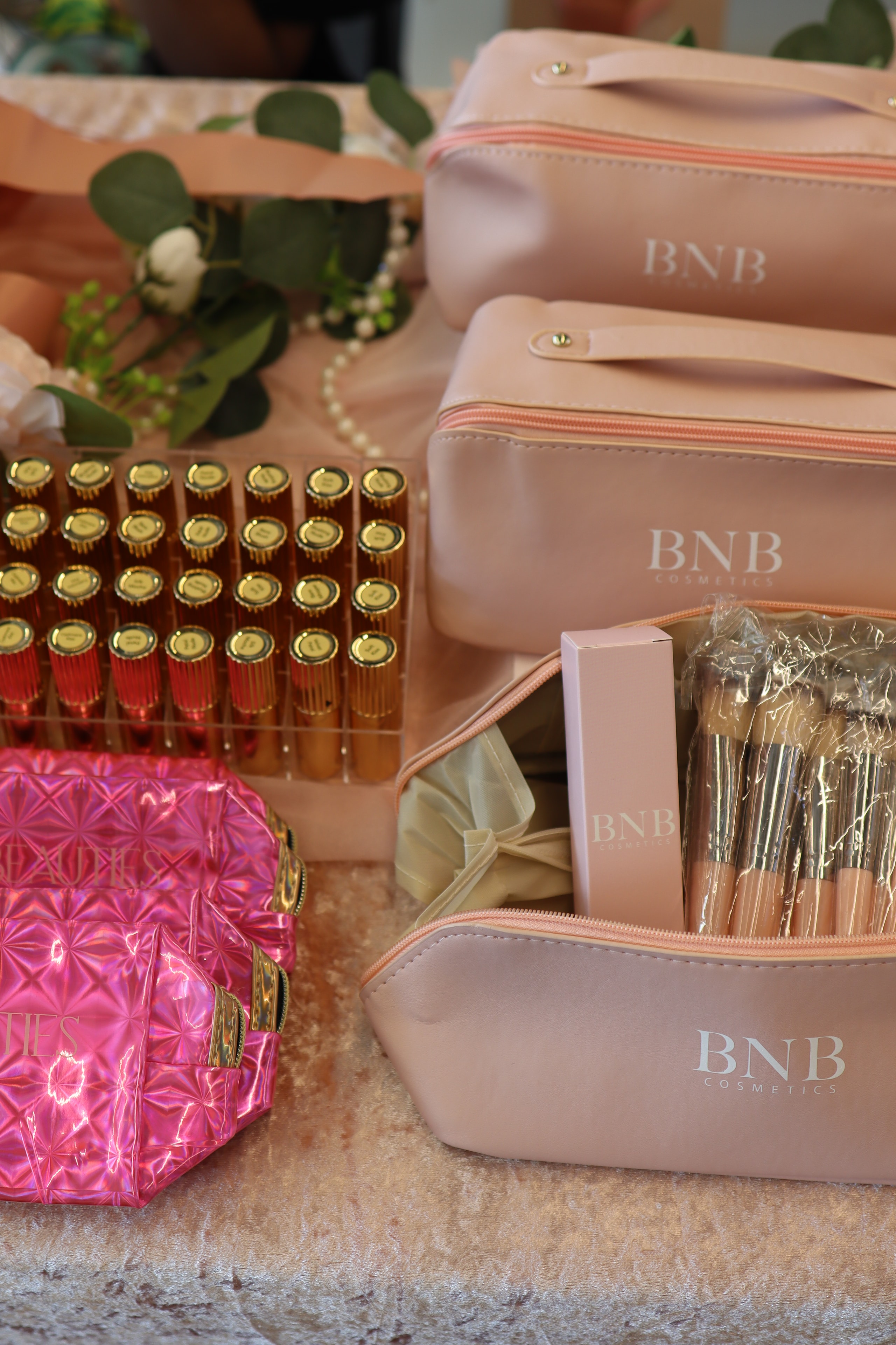 BNB Cosmetics kits with brushes and lipstick display