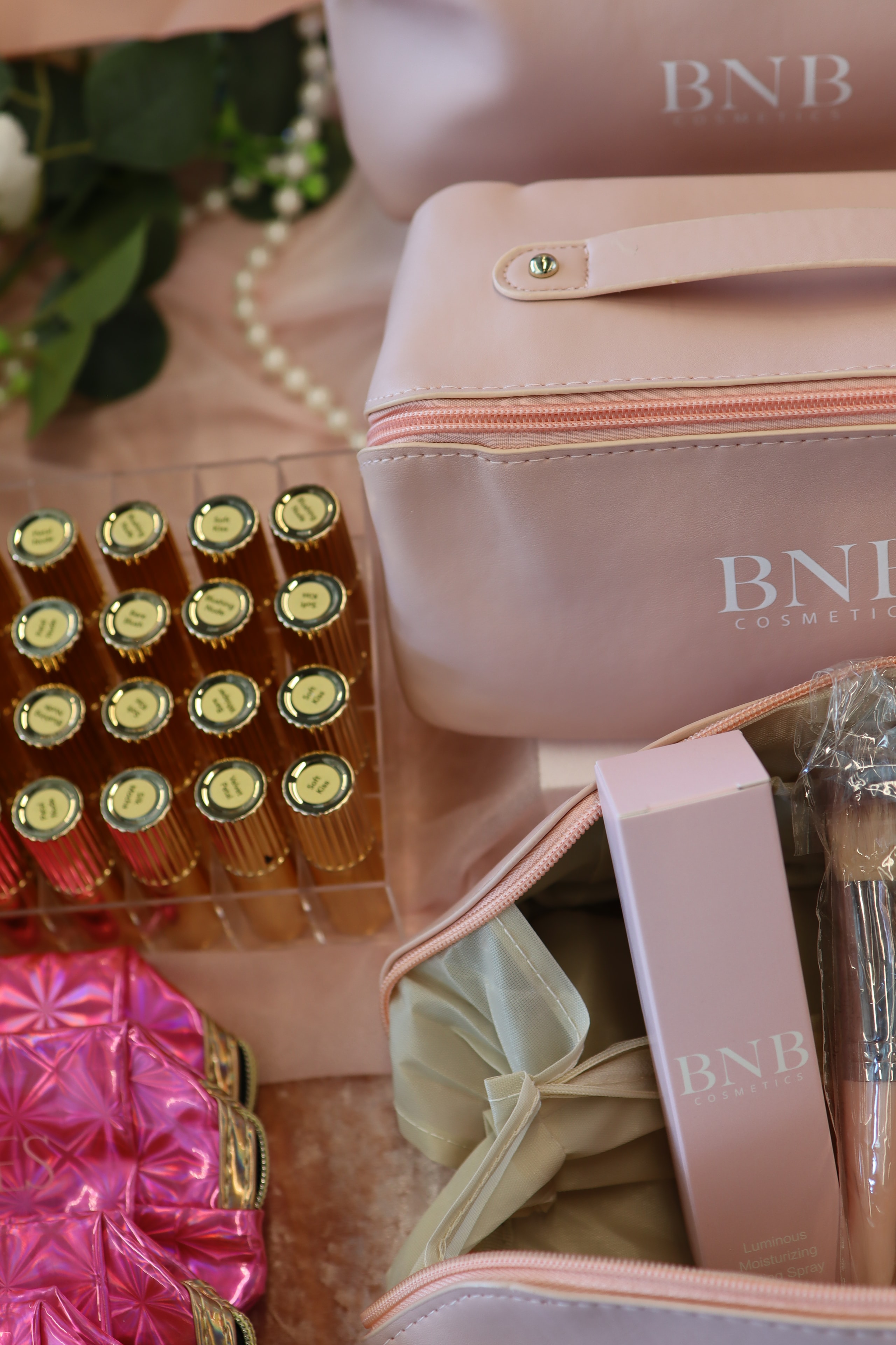 Close-up of BNB Cosmetics bag with gold lipstick display