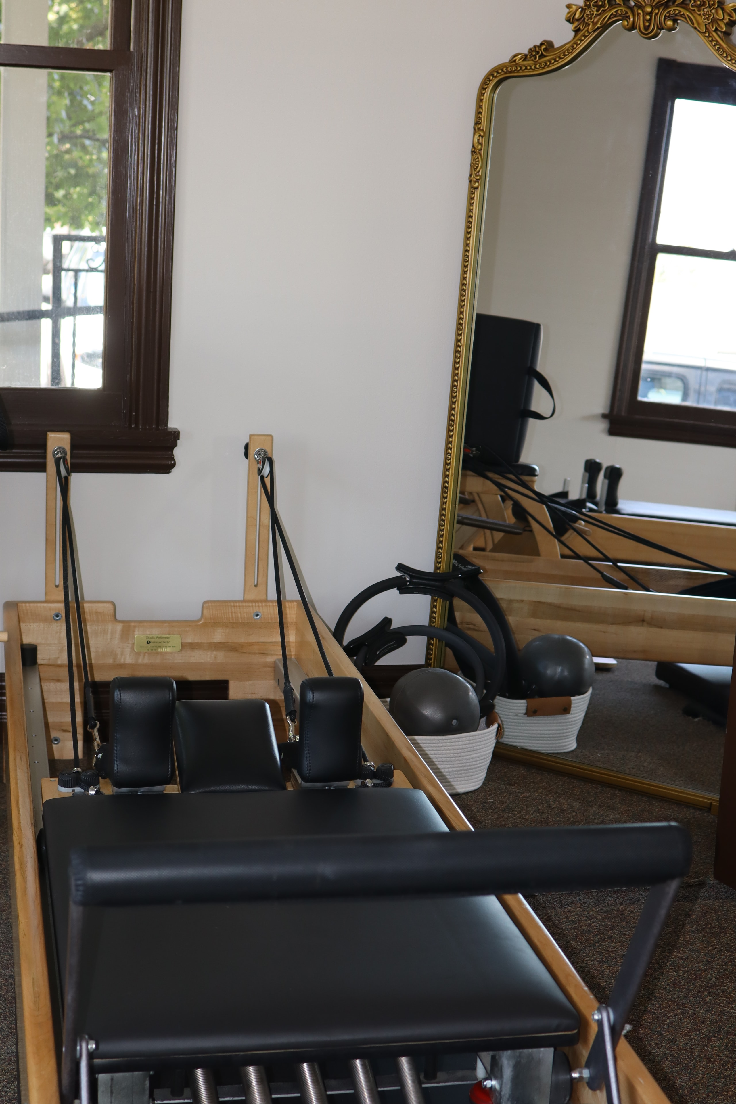 Close-up of Pilates reformer carriage and resistance springs