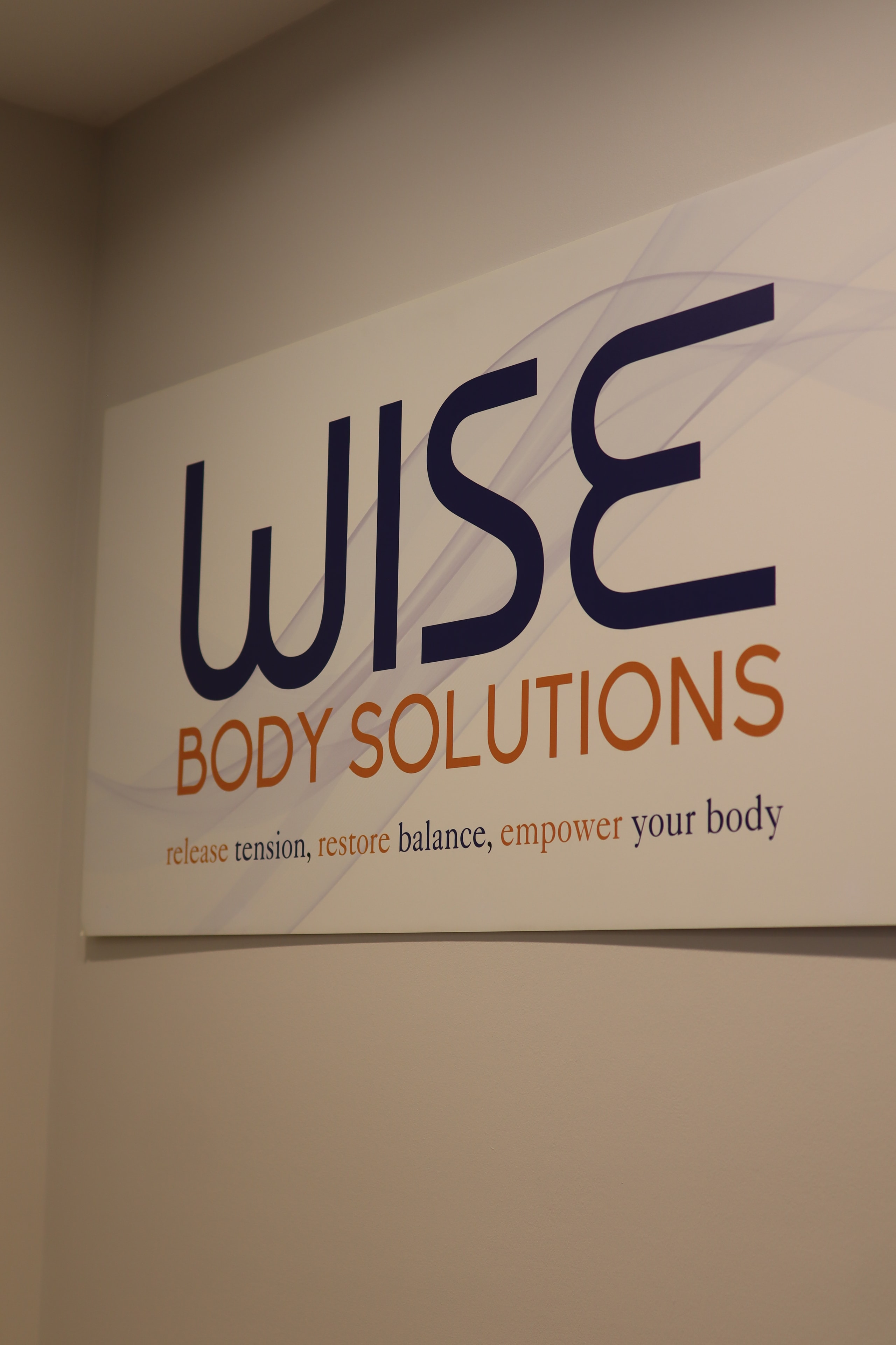 Wise Body Solutions brand sign reading release tension restore balance empower your body